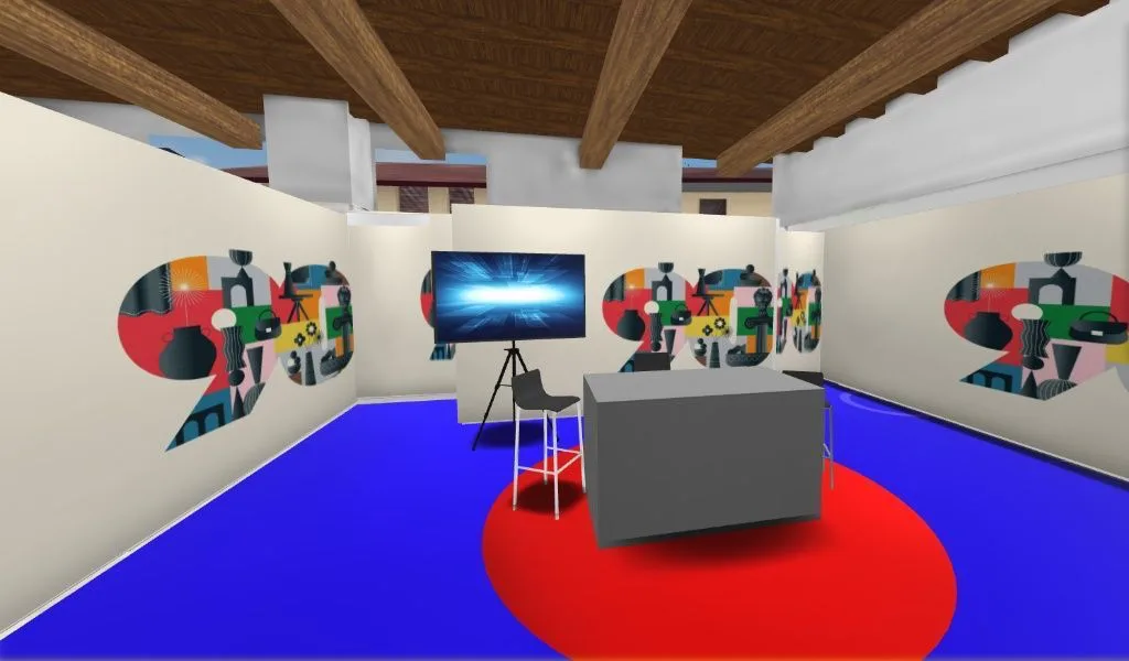 Modello 3D base di stand fieristico con pareti grafiche colorate, desk grigio, schermo su cavalletto, pavimento blu e tappeto rosso circolare